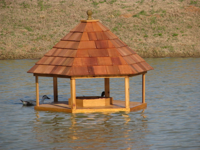 Floating 5' Hexagon Gazebo with Goose Nesting Box.  Made from cypress with cedar shake roof and styrofoam floatation---$1,200.00 plus shipping
